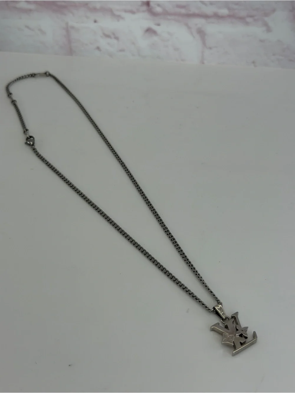 Louis Vuitton Silver LV Monogram Row Pendant Necklace